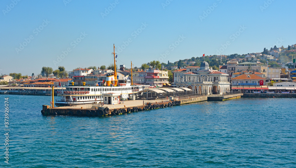 A ferry docked at the ferry station on Buyukada, one of the Princes' Islands, also known as Adalar, in the Sea of Marmara off the coast of Istanbul, Turkey