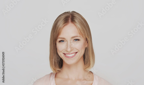 Studio portrait of young, beautiful and natural blond woman.