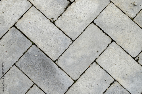 Close-up view of gray cobblestones, gray background