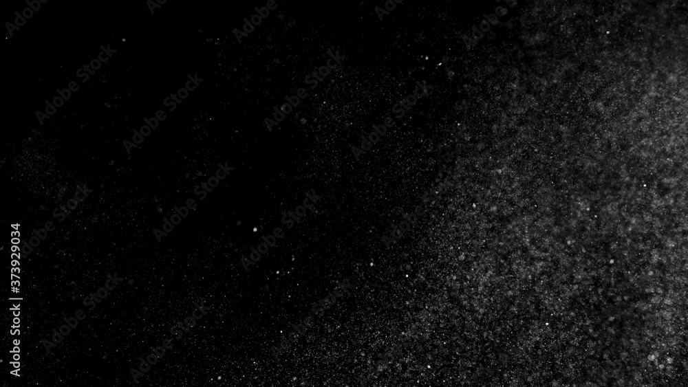 Dust particles sparkling on black background with mist sprinkling effect Dust particles sparkling on black background with mist sprinkling effect