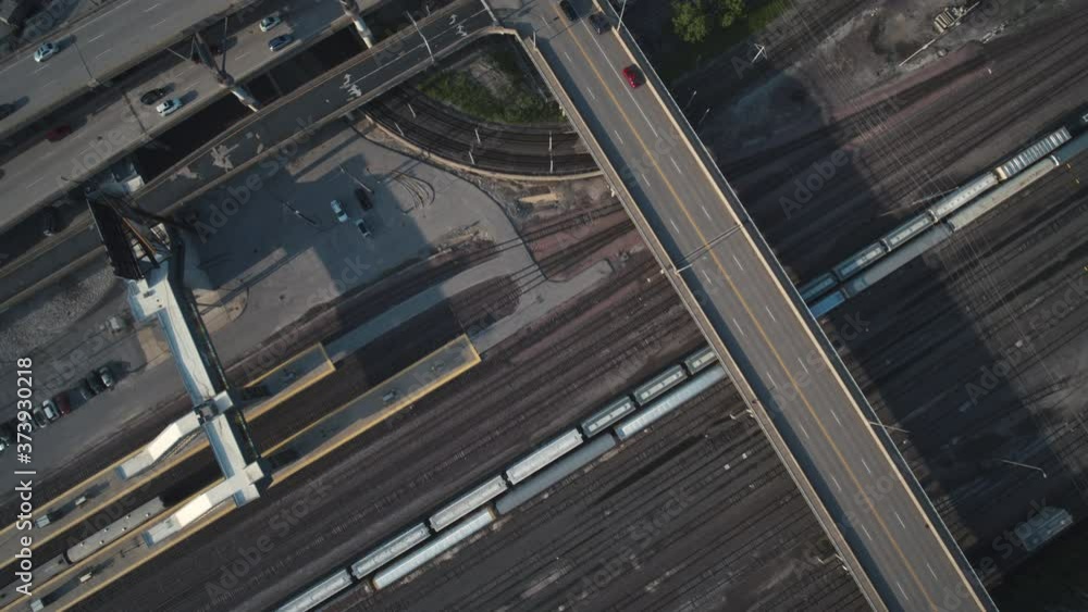 Top down of train tracks and traffic in downtown area Top down of train tracks and traffic in downtown area