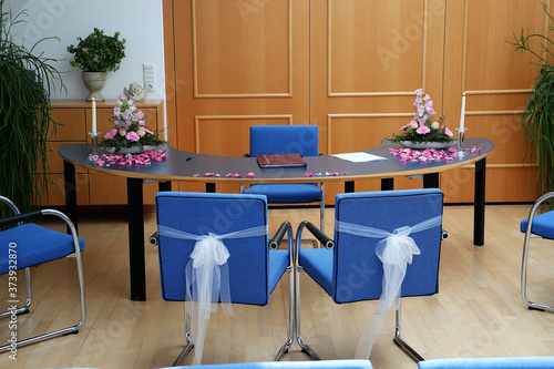 Photography Empty room with decorated blue chairs in the registry office