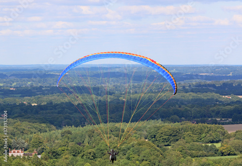 Tandem Paraglider flying at Combe Gibbet, England 