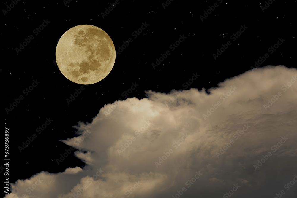 Full moon with clouds in the sky.