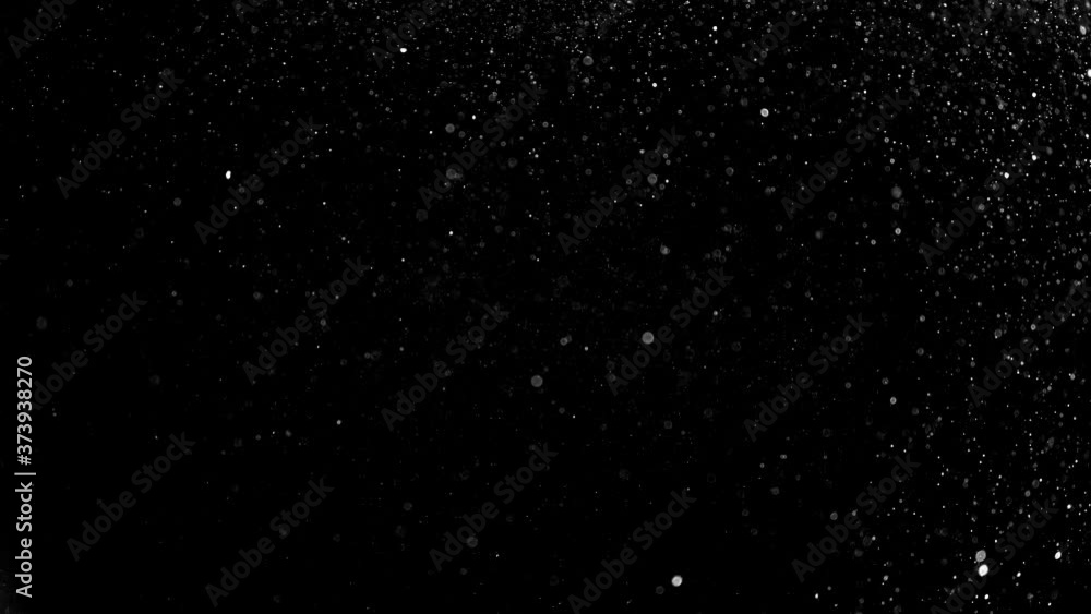 Dust particles on black background. 3D effect with snow glare and flare sparkle Dust particles on black background. 3D effect with snow glare and flare sparkle