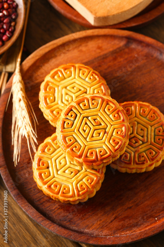 Chinese traditional mid autumn festival moon cake in wooden plate