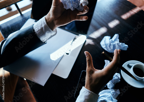 Cafe papers on the table crumpled paper coffee cup executive businesswoman lifestyle