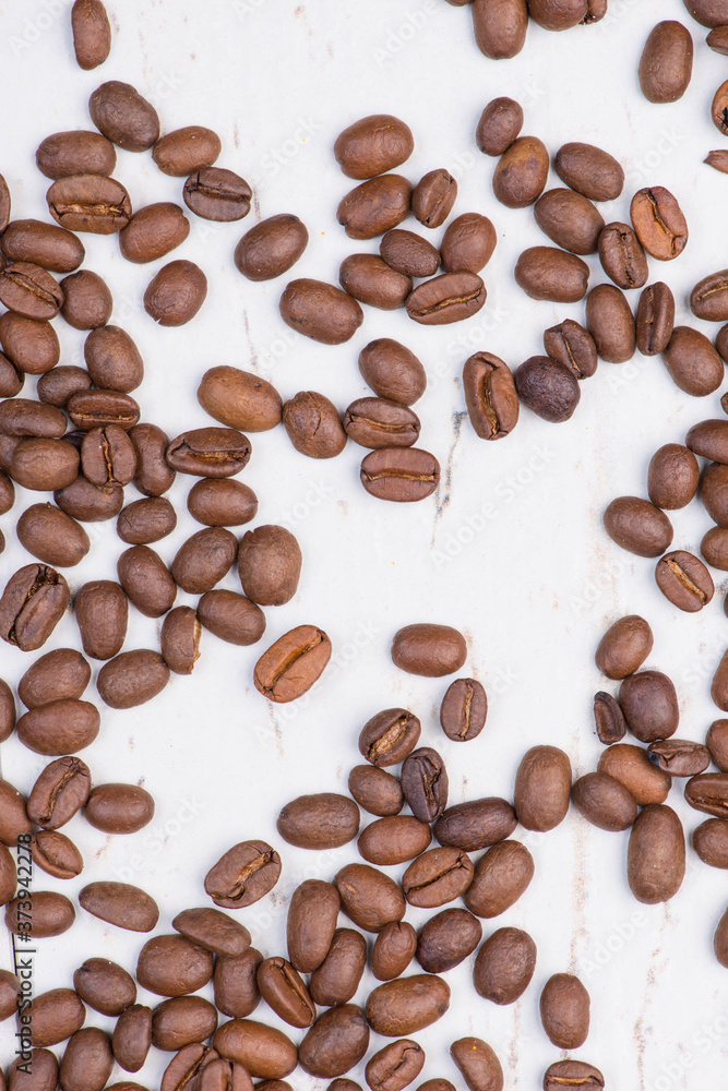 Roasted coffee beans on a textured background, empty copy space