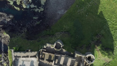 Dramatic aerial view of Dunluce Castle in County Antrim Northern Ireland. photo