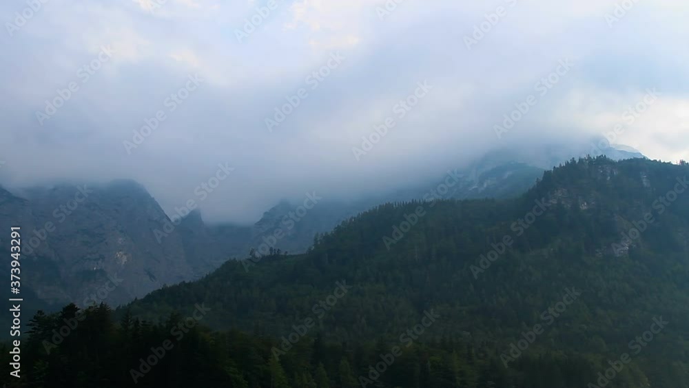 Time lapse misty cloud, fog on top of Austria Alps mountain after rain Time lapse misty cloud, fog on top of Austria Alps mountain after rain