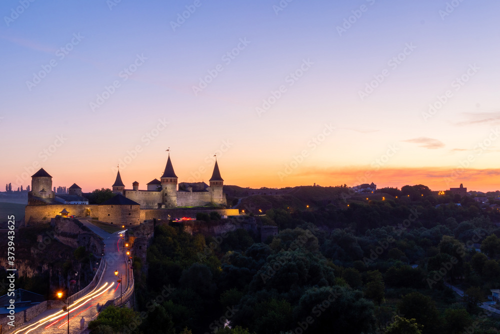 Old castle. Sunset view of the castle in Kamyanets-Podilsky Ukraine. Castle photo on a postcard or cover
