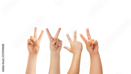 Peace, greeting. Kids hands gesturing isolated on white studio background, copyspace for ad. Crowd of kids gesturing. Concept of childhood, education, preschool and school time. Signs and senses.