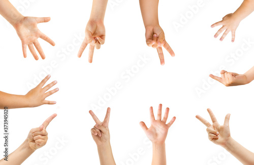 Pointing in center. Kids hands gesturing isolated on white studio background, copyspace for ad. Crowd of kids gesturing. Concept of childhood, education, preschool and school time. Signs and senses.
