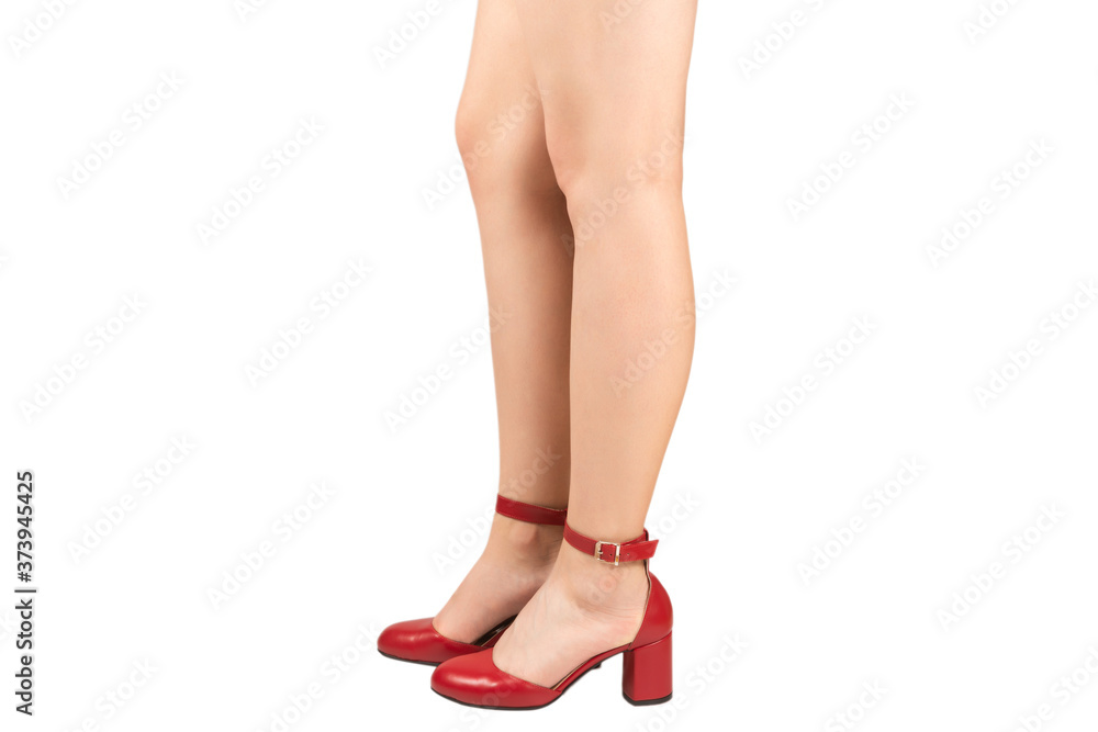 Woman legs in retro red sandals on heels. Woman legs in retro red sandals on heels.