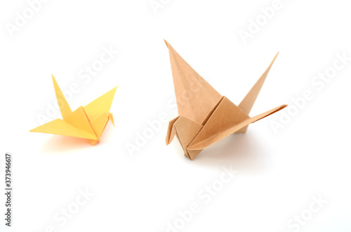Two origami birds on white