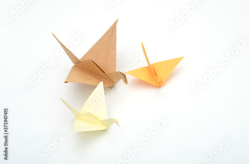 three origami birds on white