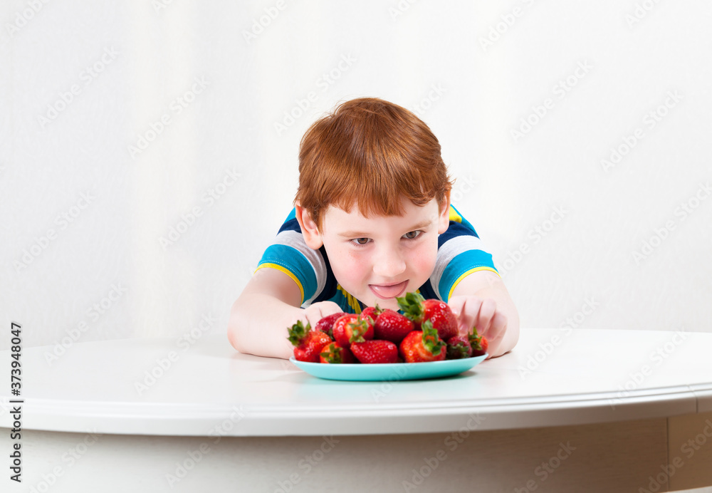 boy and strawberries boy and strawberries