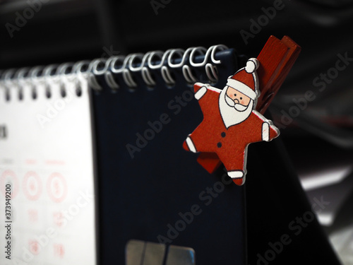 little Santa on office desk calendar photo