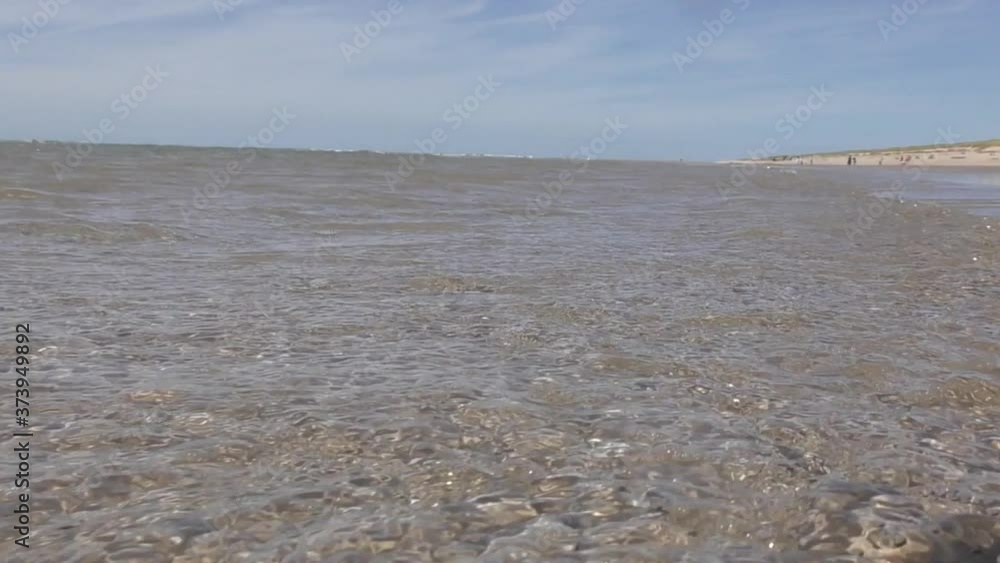 small waves roolling on the beach small waves roolling on the beach
