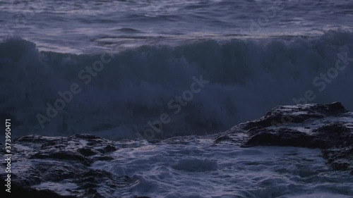 Wallpaper Mural Close-up: Ocean spray crashes down on rocky tide pool. Filmed at sunset on the Oregon Coast. Torontodigital.ca