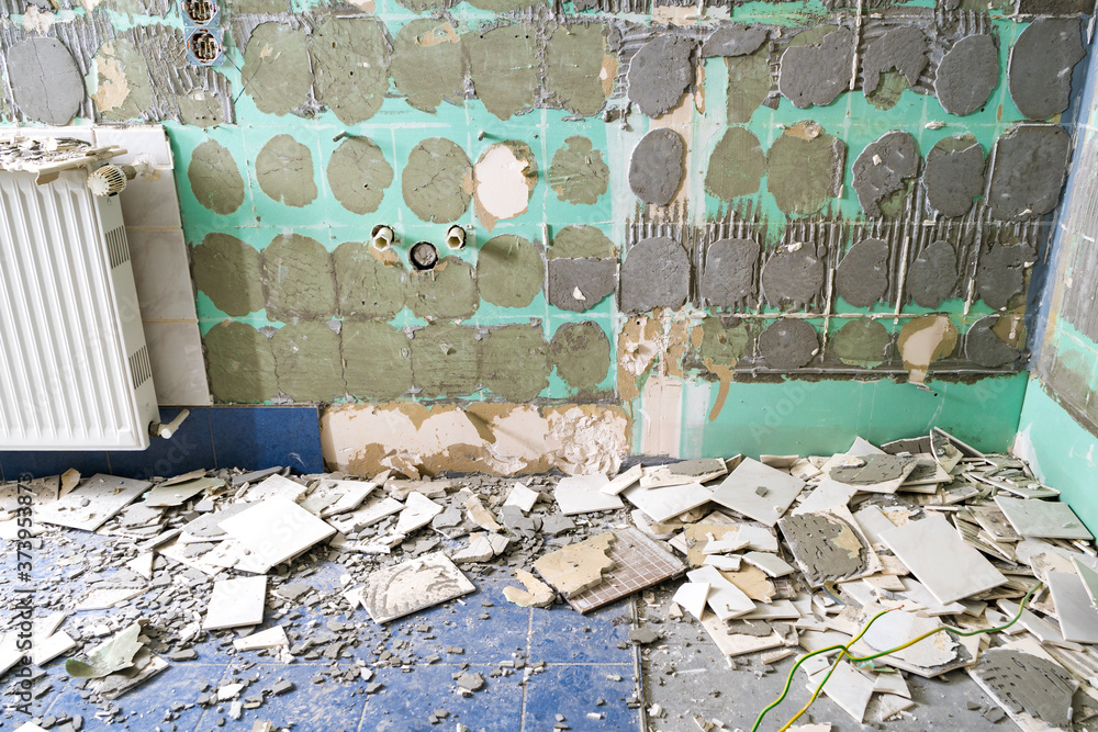 Pile of ceramic tiles remains after bathroom renovation prepared to be