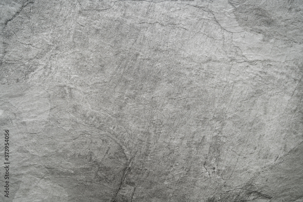 Naklejka premium Close up of light grey black slate stone background or texture