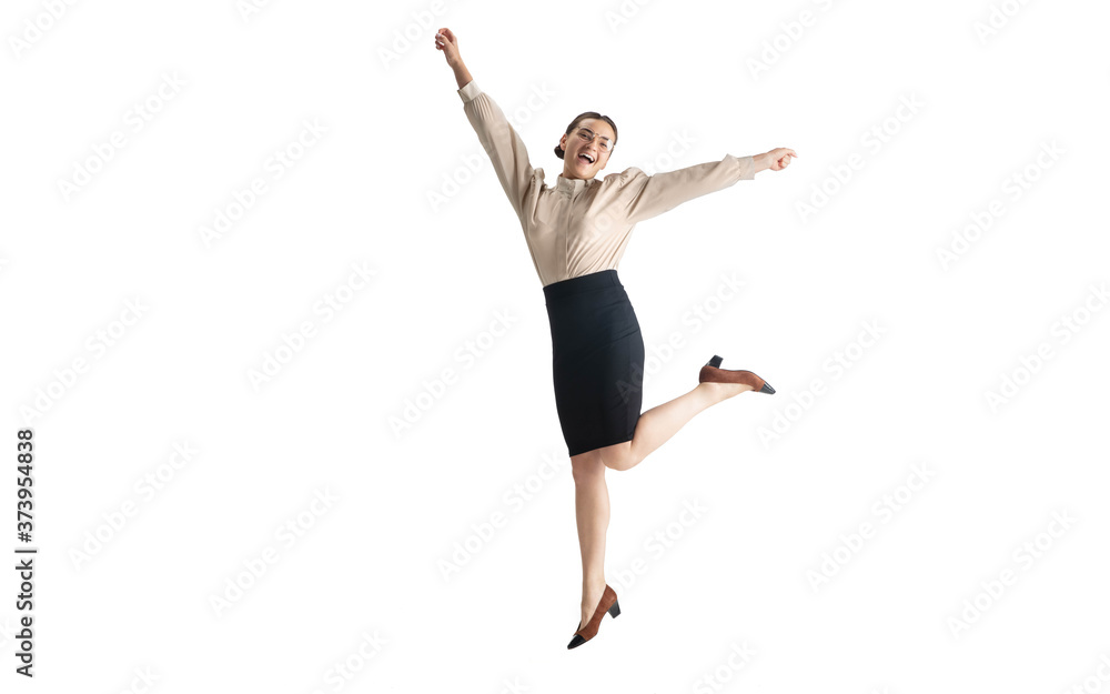 Beautiful business woman, secretary, manager on white studio background. Beautiful caucasian female model in office attire. Copyspace for ad, Concept of business, finance, occupation. Dancing, jumping