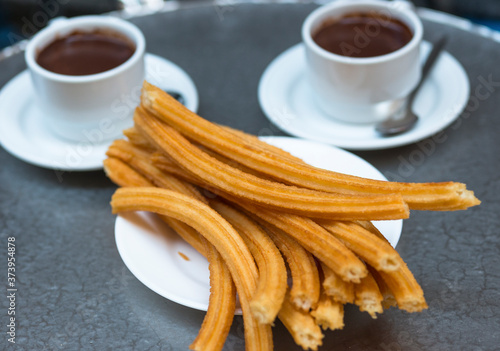 Churros with chocolate at Madrid Cafe, Spain.  photo