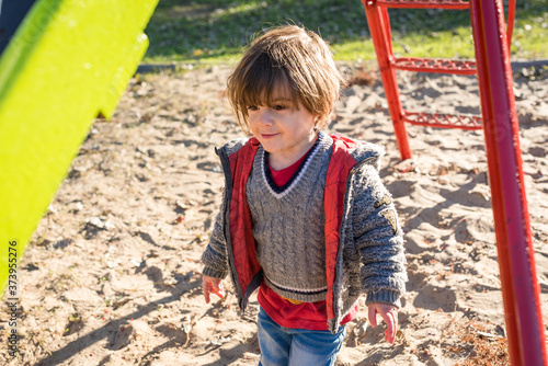 little boy on a swing