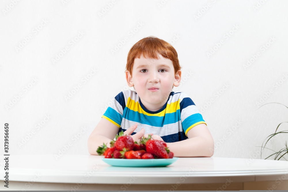 handsome boy with strawberries handsome boy with strawberries