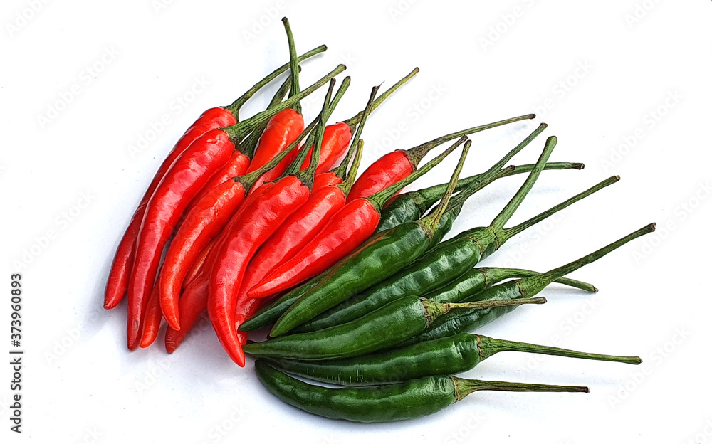 Red and green fresh chillies on white background. Red and green fresh chillies on white background.