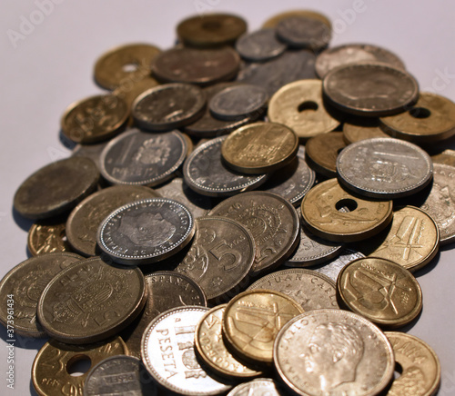 Pile of peseta coins with white background
