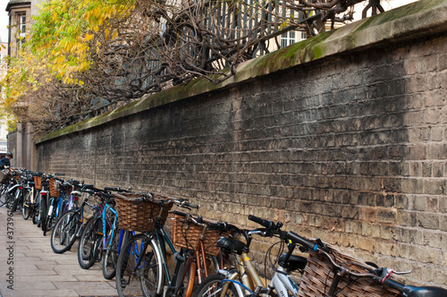 Canvas Print A line of bicycles parked outside a Sydney Sussex college