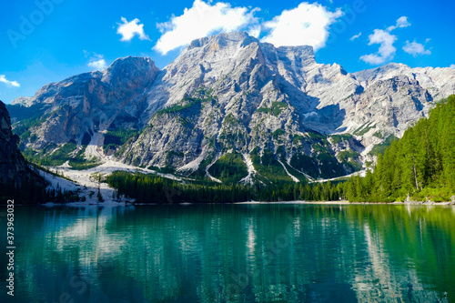 reflection of mountains in lake Brais, Dolomites photo