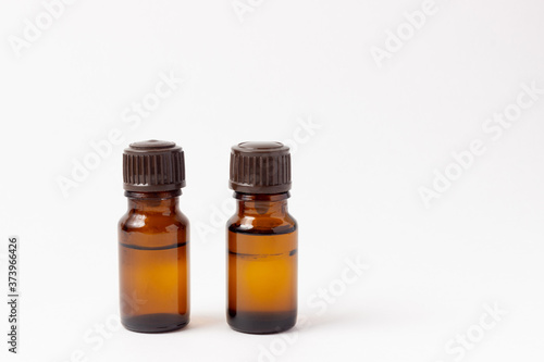 A set of amber bottles for essential oils and cosmetics. Glass bottle. Dropper, spray bottle