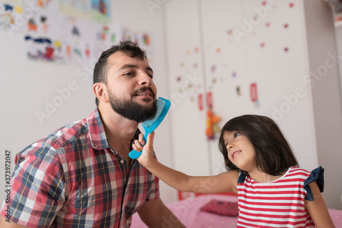 Wallpaper Mural While playing, daughter combs her father's beard Torontodigital.ca