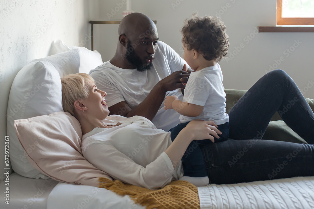 Happy family resting at home, a multicultural family Happy family resting at home, a multicultural family