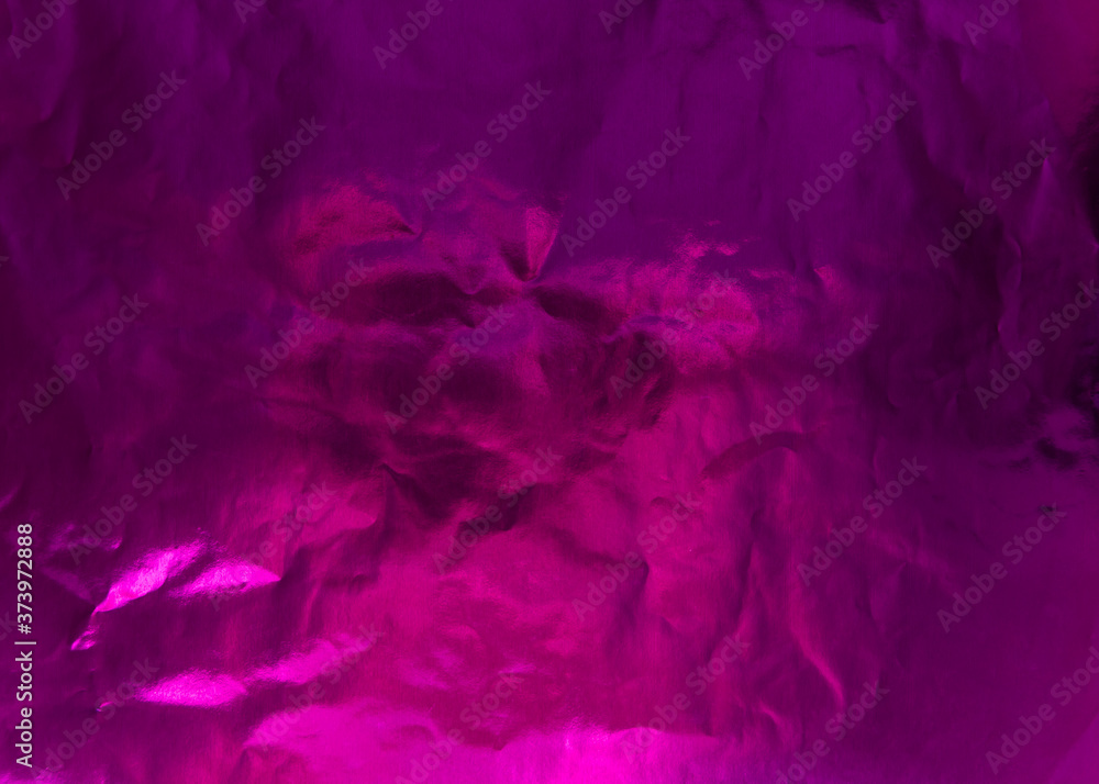 Fototapeta premium Crumpled textured foil with color highlighting. Textured colour paper. Purple colour.