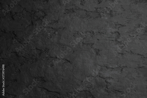 Blank black stone wall texture mock up, front view