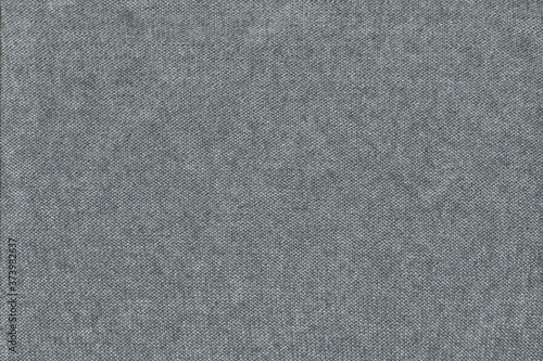 The texture of grey knitted knitwear on the wrong side. The inside out natural cotton Jersey.
