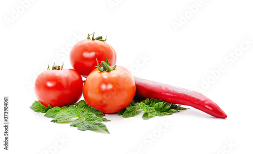 Ripe red tomatoes and pepper.