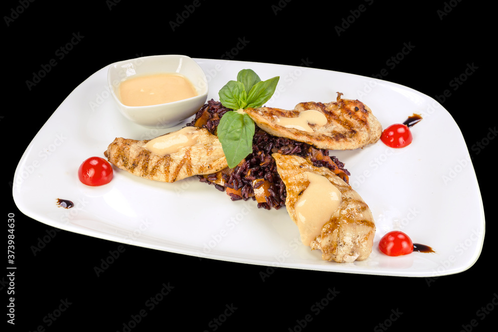 Delicious  chicken fillets with imperator rice on a plate