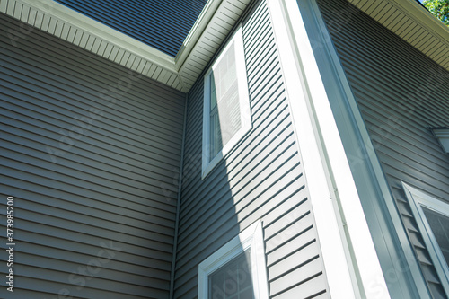 Картината върху платно New vinyl siding and window treatments at a residential home.