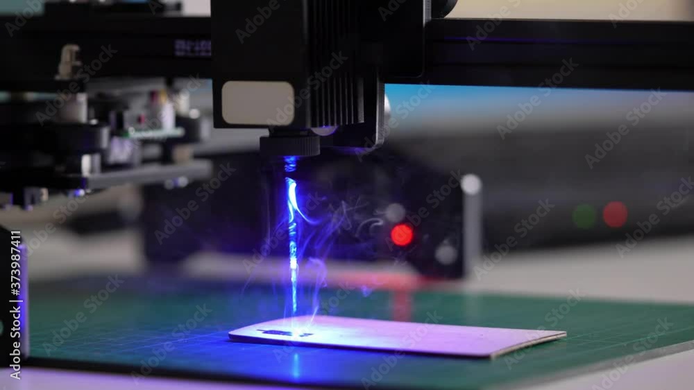 Modern Laser Cutting CNC tool. Automation High precision laser manufacturing of parts. Close up computer cnc on dark background.