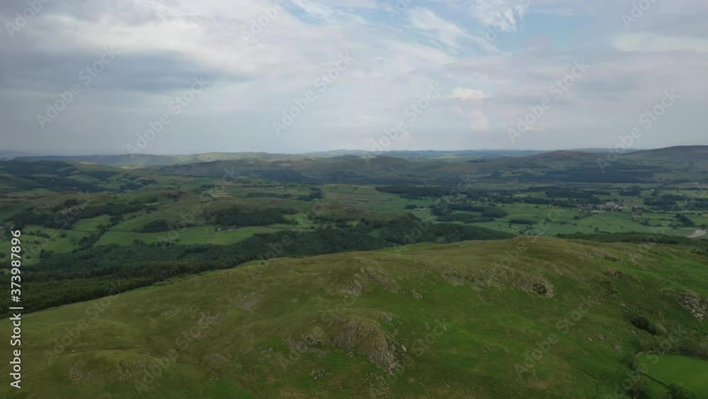 Aerial shot of the hilly landscape in the English Lake District, bright summers day. Aerial shot of the hilly landscape in the English Lake District, bright summers day.