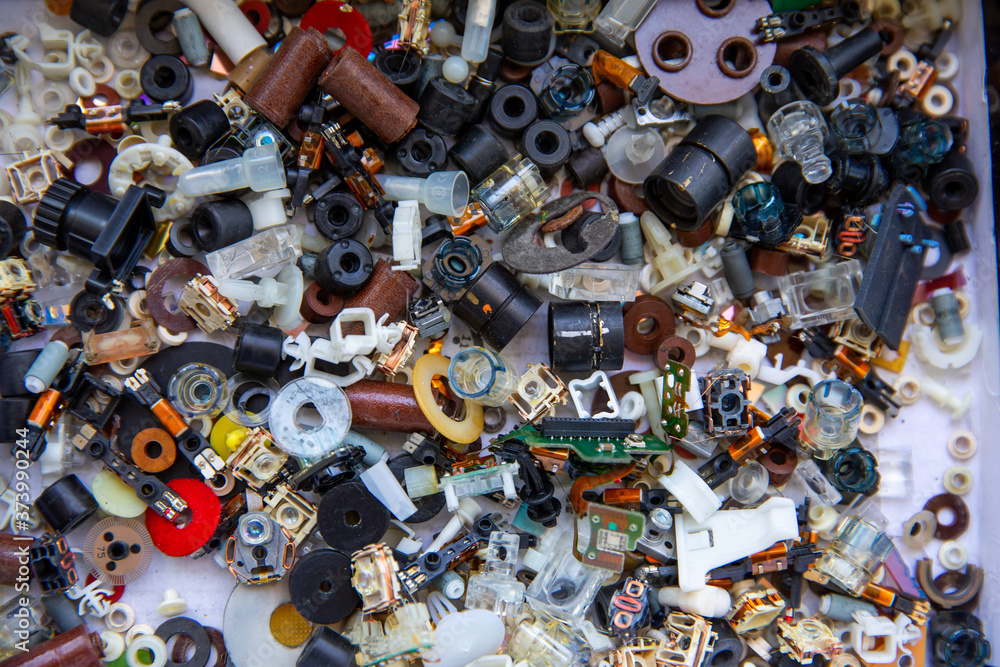 A lot of small plastic parts from old computers and printers. Computer junk. A lot of small plastic parts from old computers and printers. Computer junk.