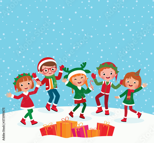 Group of children having fun outdoors in winter in Christmas suits