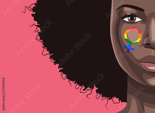 Close up portrait of young beautiful black woman with face painting of Venus symbol in rainbow colors of LGBT flag
