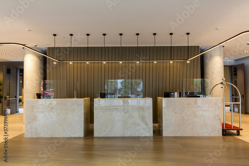 Canvas Print Interior of a hotel lobby with reception desks with transparent covid plexiglass