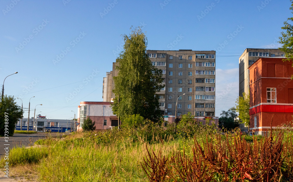 Fototapeta premium Modern town houses of brick and glass on urban street